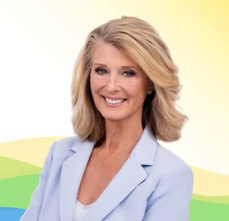 Lori Tolland, elected Ormond Beach's first female mayor, in a campaign portrait wearing a light blue blazer.
